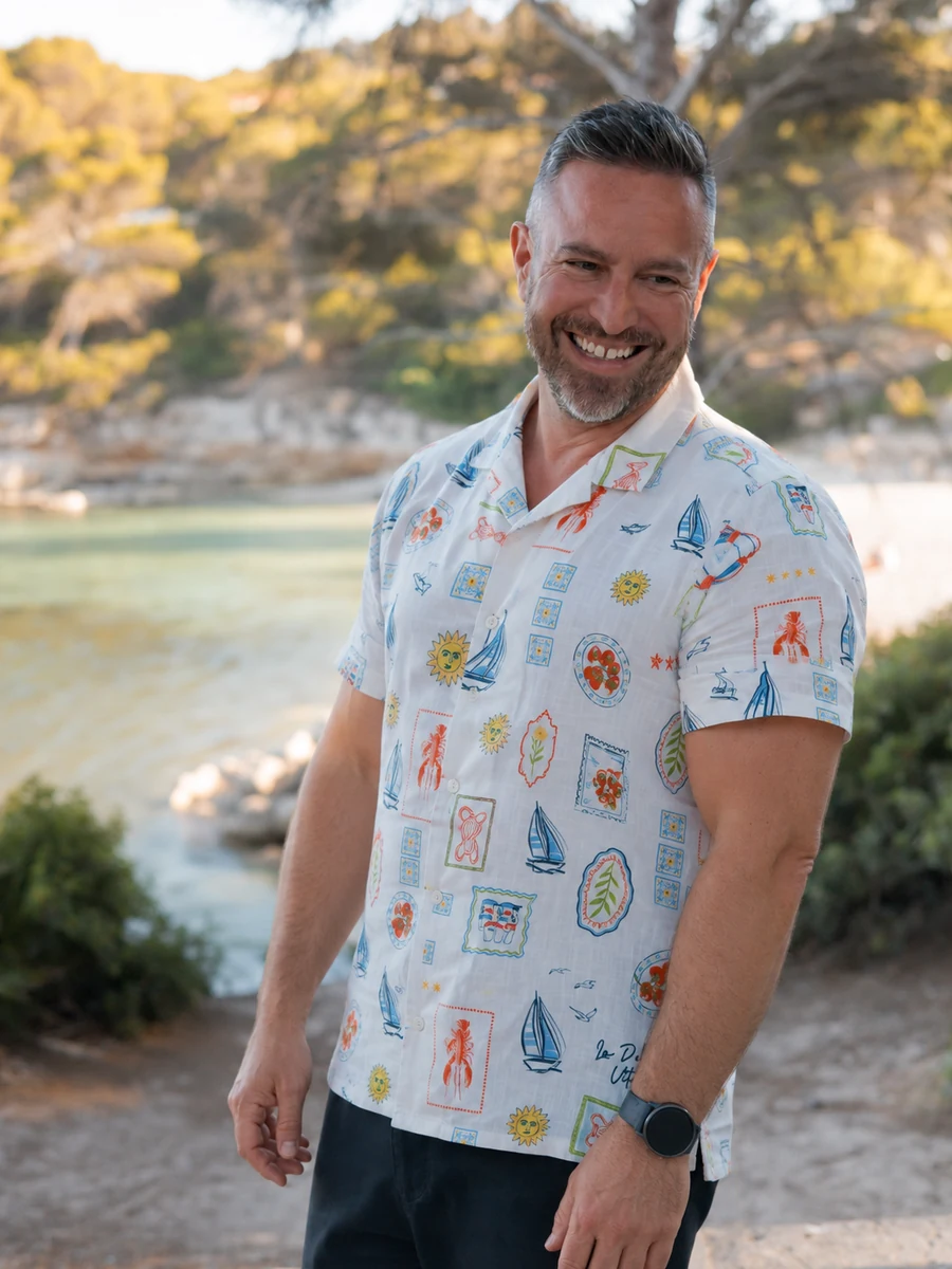 Garreth Sleigh smiling outdoors beside the water
