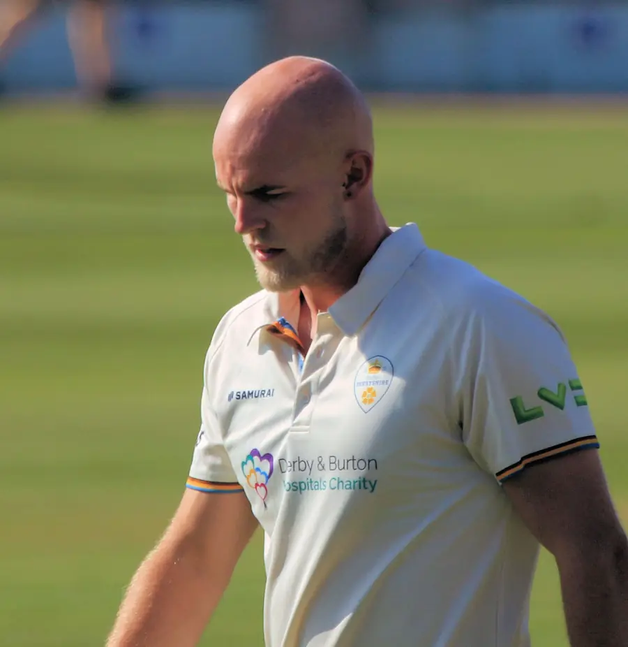 Zak Chappell walking from the field in Derbyshire whites
